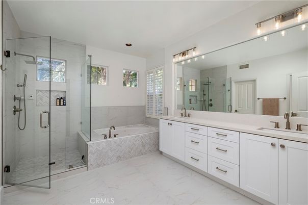 Bathroom, Dual Sink Vanities, Glass Shower, Interior, Marble, Marble Walls, Recessed Lighting