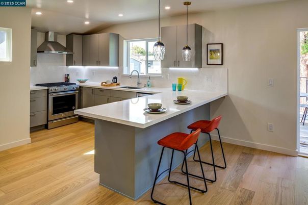 Interior, Kitchen, Pendant Lights, Recessed Lighting, Stainless Steel Appliances, Wood Texture Flooring