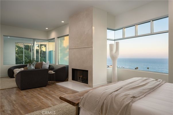 Bedroom, Fireplace, Interior, Recessed Lighting, Water, Wood Texture Flooring