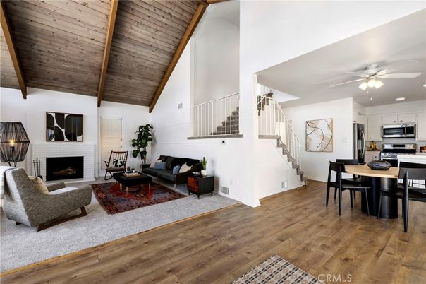 Dining room, Fireplace, Interior, Kitchen, Living room, Recessed Lighting, Stainless Steel Appliances, Wooden Ceilings, Wood Texture Flooring