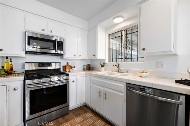 Interior, Kitchen, Stainless Steel Appliances, Tile Countertops, Wood Texture Flooring