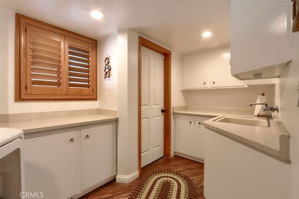 Interior, Kitchen, Recessed Lighting, Washer, Wood Texture Flooring