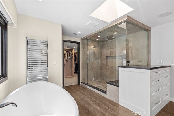 Bathroom, Free Standing Baths, Glass Shower, Interior, Recessed Lighting, Wood Texture Flooring