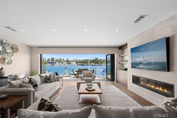 Fireplace, Interior, Living room, Recessed Lighting, Water, Wood Texture Flooring