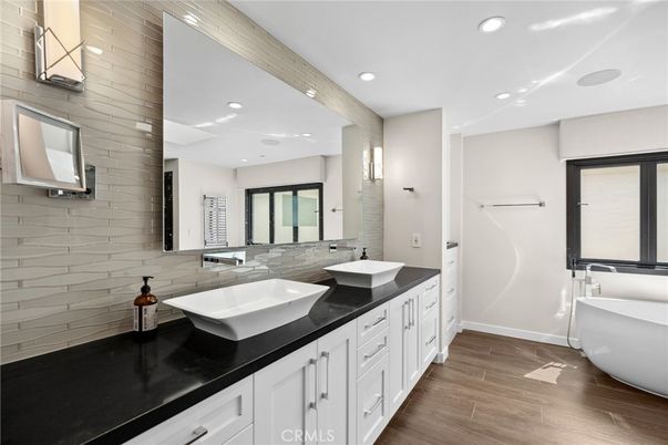Bathroom, Dual Sink Vanities, Free Standing Baths, Interior, Recessed Lighting, Wood Texture Flooring