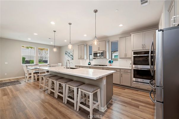 Dining room, Interior, Kitchen, Pendant Lights, Recessed Lighting, Stainless Steel Appliances, Wood Texture Flooring