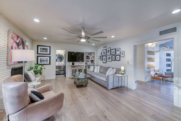 Fireplace, Interior, Living room, Recessed Lighting, Stone Walls, Wood Texture Flooring