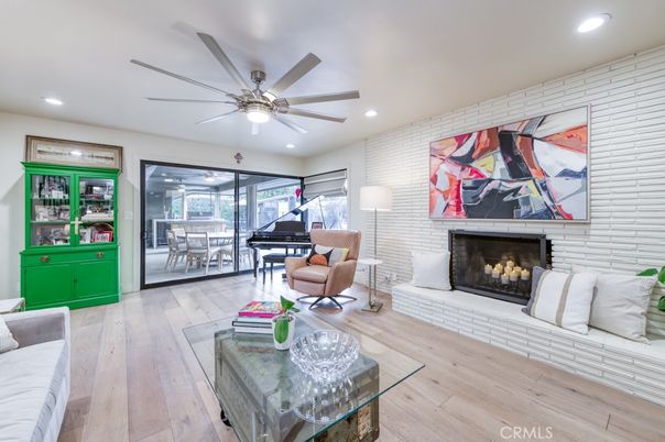 Fireplace, Interior, Living room, Piano, Recessed Lighting, Stone Walls, Wood Texture Flooring