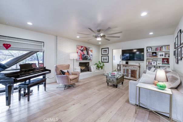 Fireplace, Interior, Living room, Piano, Recessed Lighting, Wood Texture Flooring