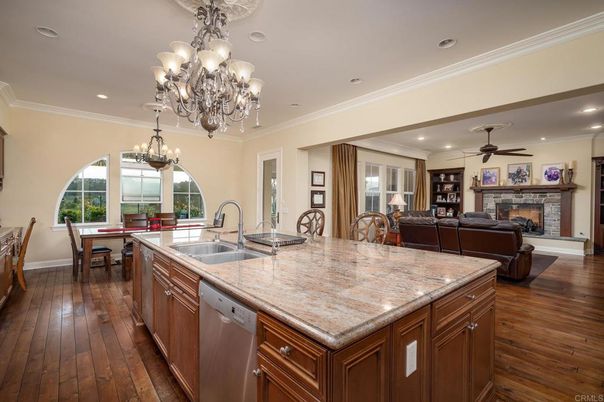Chandelier, Dining room, Fireplace, Interior, Kitchen, Living room, Recessed Lighting, Wood Texture Flooring