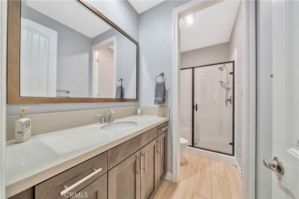 Bathroom, Dual Sink Vanities, Glass Shower, Interior, Wood Texture Flooring