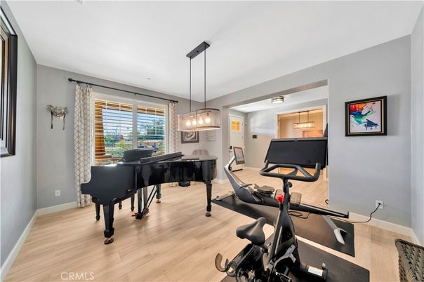 Billiard Table, Fitness Equipment, Game Room, Interior, Pendant Lights, Piano, Wood Texture Flooring