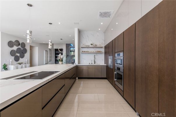 Interior, Kitchen, Marble Walls, Pendant Lights, Recessed Lighting, Stainless Steel Appliances