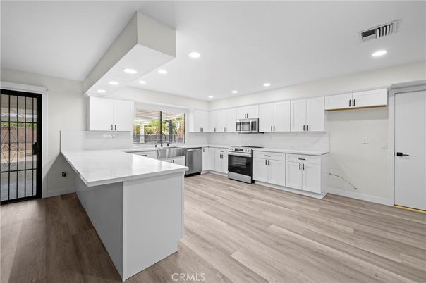 Interior, Kitchen, Recessed Lighting, Stainless Steel Appliances, Wood Texture Flooring
