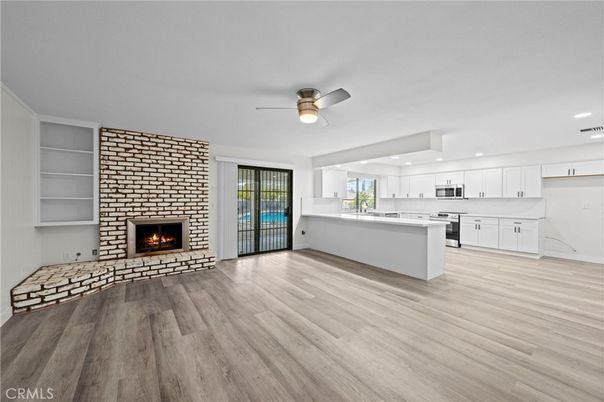 Empty room, Fireplace, Interior, Kitchen, Recessed Lighting, Wood Texture Flooring