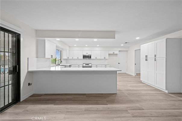 Interior, Kitchen, Recessed Lighting, Stainless Steel Appliances, Wood Texture Flooring