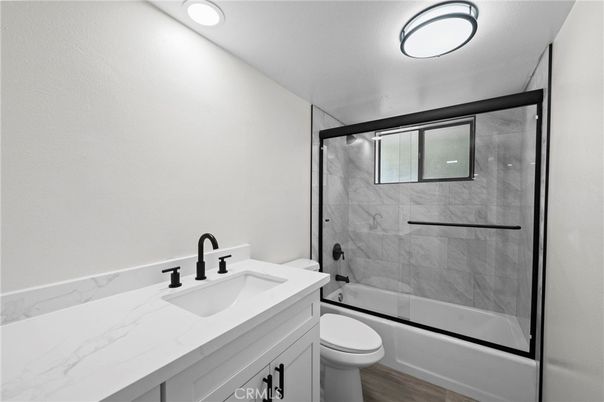 Bathroom, Glass Shower, Interior, Marble Walls, Recessed Lighting, Wood Texture Flooring