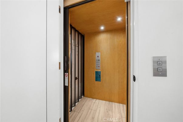 Elevator, Interior, Recessed Lighting, Wooden Ceilings, Wood Texture Flooring, Wooden Walls