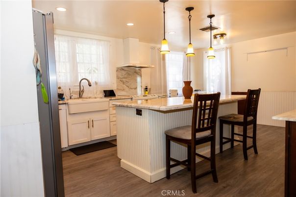 Interior, Kitchen, Marble Walls, Pendant Lights, Recessed Lighting, Wood Texture Flooring