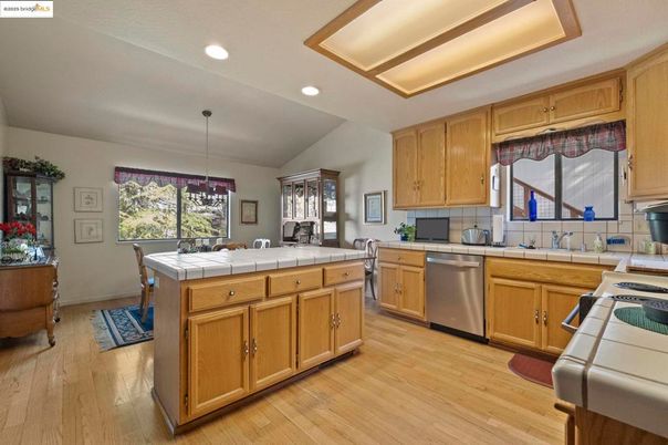 Interior, Kitchen, Pendant Lights, Recessed Lighting, Tile Countertops, Wood Texture Flooring