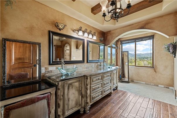 Bathroom, Chandelier, Dual Sink Vanities, Interior, Wood Texture Flooring