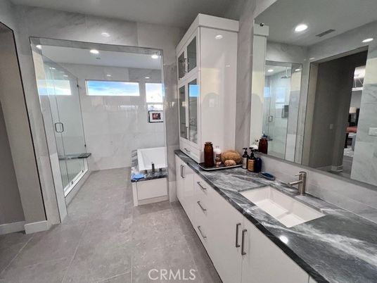 Bathroom, Dual Sink Vanities, Glass Shower, Interior, Marble Walls, Recessed Lighting