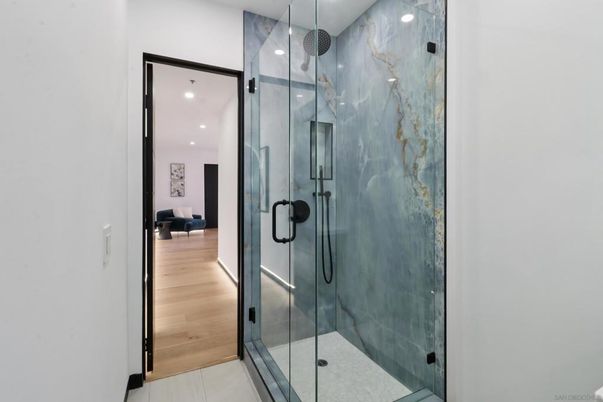 Bathroom, Glass Shower, Interior, Marble Walls, Recessed Lighting, Wood Texture Flooring