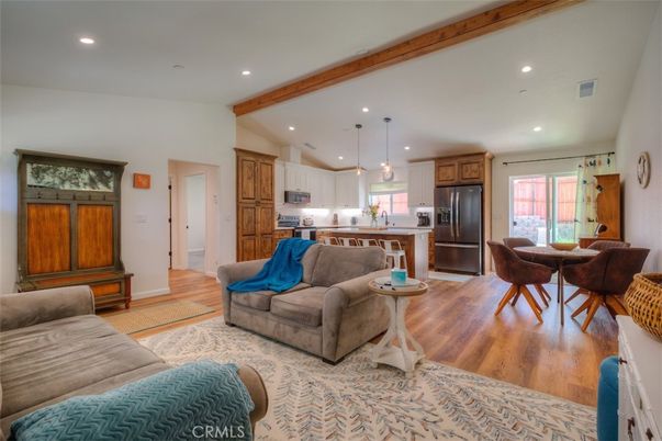 Dining room, Interior, Kitchen, Living room, Pendant Lights, Recessed Lighting, Stainless Steel Appliances, Wooden Beams, Wood Texture Flooring