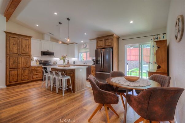 Dining room, Interior, Kitchen, Pendant Lights, Recessed Lighting, Stainless Steel Appliances, Wood Texture Flooring