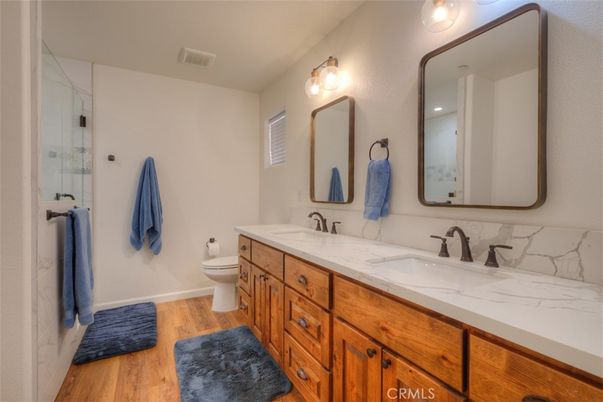 Bathroom, Dual Sink Vanities, Glass Shower, Interior, Wood Texture Flooring