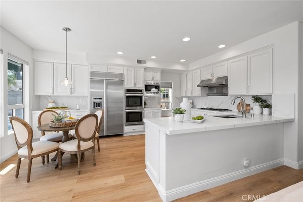 Dining room, Interior, Kitchen, Pendant Lights, Recessed Lighting, Stainless Steel Appliances, Wood Texture Flooring