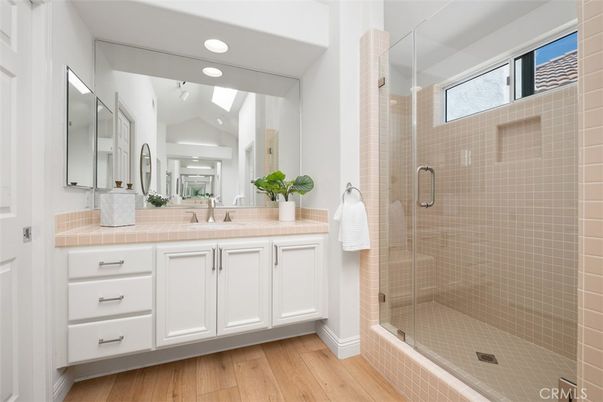 Bathroom, Glass Shower, Interior, Recessed Lighting, Tile Countertops, Wood Texture Flooring
