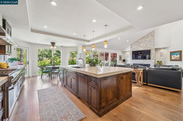 Dining room, Fireplace, Interior, Kitchen, Living room, Pendant Lights, Recessed Lighting, Stainless Steel Appliances, Stone Walls, Wood Texture Flooring