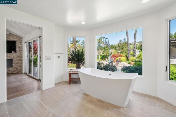 Bathroom, Free Standing Baths, Interior, Recessed Lighting, Stone Walls, Wood Texture Flooring
