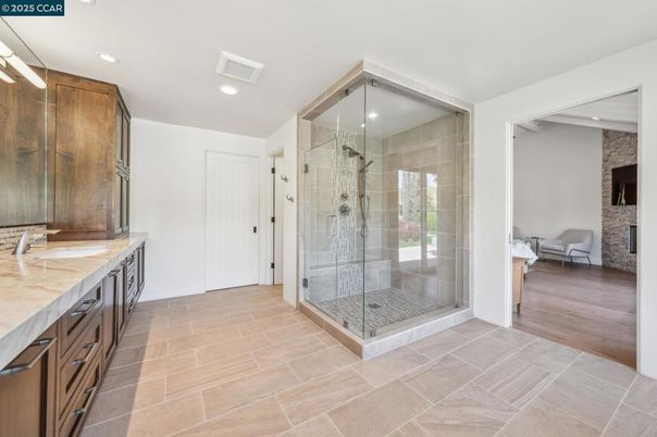Bathroom, Bedroom, Glass Shower, Interior, Recessed Lighting, Stone Walls, Wood Texture Flooring