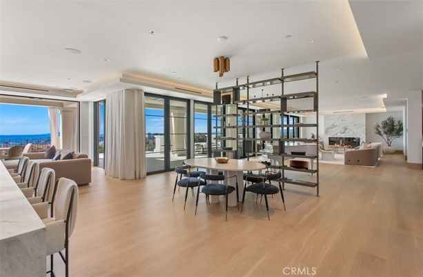 Dining room, Fireplace, Interior, Living room, Pendant Lights, Recessed Lighting, Water, Wood Texture Flooring