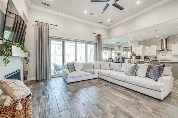 Fireplace, Interior, Kitchen, Living room, Pendant Lights, Recessed Lighting, Stainless Steel Appliances, Wood Texture Flooring