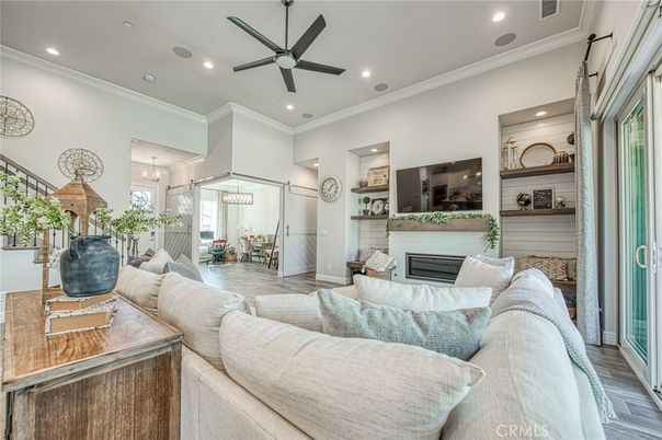 Dining room, Fireplace, Interior, Living room, Pendant Lights, Recessed Lighting, Wood Texture Flooring