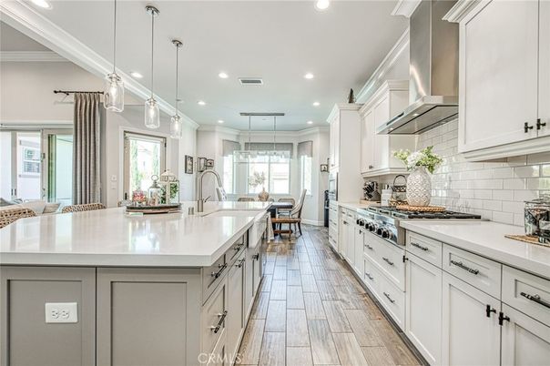 Dining room, Interior, Kitchen, Pendant Lights, Recessed Lighting, Stainless Steel Appliances, Wood Texture Flooring