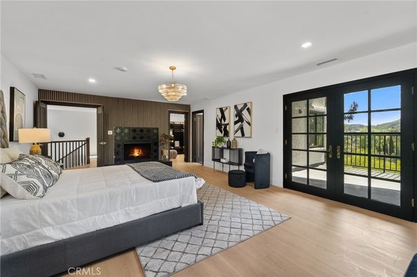 Bedroom, Chandelier, Fireplace, Interior, Recessed Lighting, Wood Texture Flooring