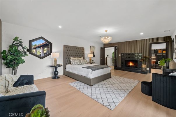 Bedroom, Chandelier, Fireplace, Interior, Recessed Lighting, Wood Texture Flooring