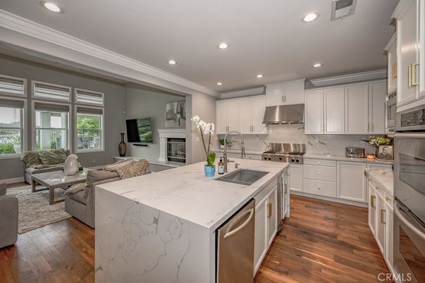 Fireplace, Interior, Kitchen, Living room, Recessed Lighting, Stainless Steel Appliances, Wood Texture Flooring