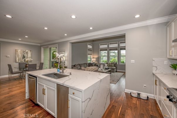 Dining room, Interior, Kitchen, Living room, Recessed Lighting, Stainless Steel Appliances, Wood Texture Flooring