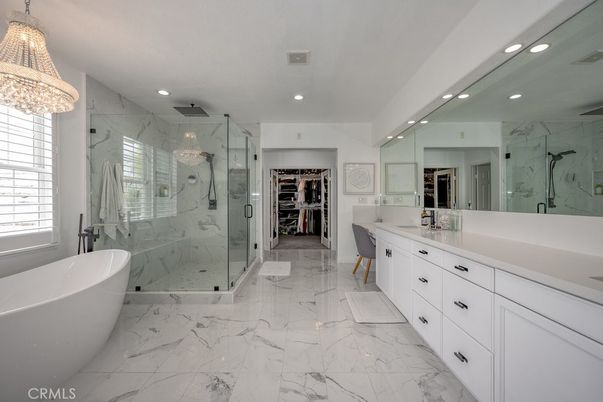 Bathroom, Chandelier, Dual Sink Vanities, Free Standing Baths, Glass Shower, Interior, Marble, Marble Walls, Recessed Lighting, Walk-in Closets
