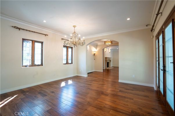 Chandelier, Empty room, Fireplace, Interior, Recessed Lighting, Wood Texture Flooring