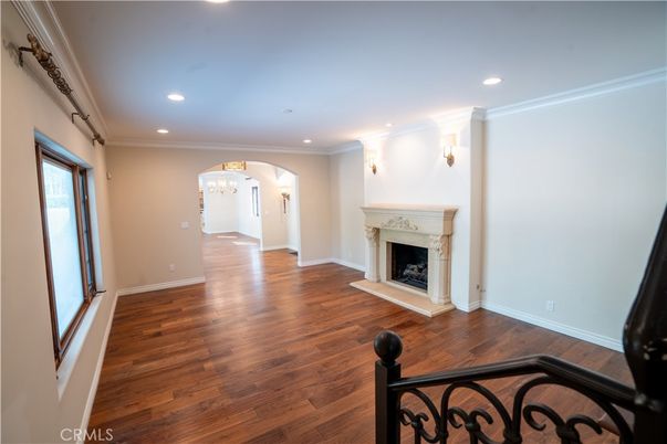 Chandelier, Empty room, Fireplace, Interior, Recessed Lighting, Wood Texture Flooring