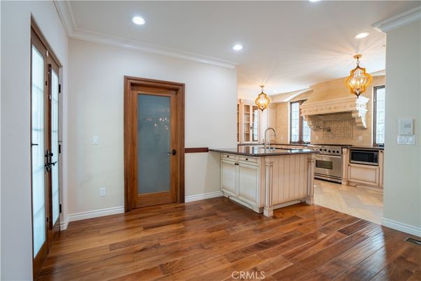 Chandelier, Interior, Kitchen, Recessed Lighting, Stainless Steel Appliances, Wood Texture Flooring