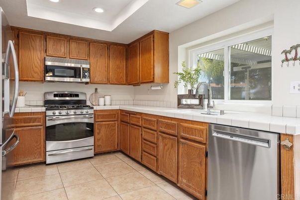 Interior, Kitchen, Recessed Lighting, Stainless Steel Appliances, Tile Countertops