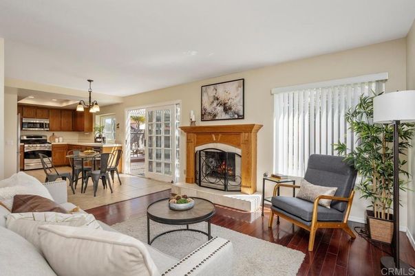 Dining room, Fireplace, Interior, Kitchen, Living room, Pendant Lights, Stainless Steel Appliances, Wood Texture Flooring