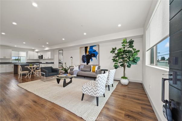 Dining room, Interior, Kitchen, Living room, Recessed Lighting, Stainless Steel Appliances, Wood Texture Flooring